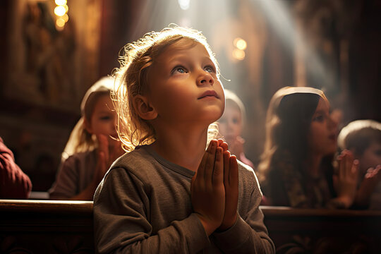 kids pray to god and jesus in the church