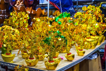 many decorations as symbol of wealth in the market for Tet Lunar New Year