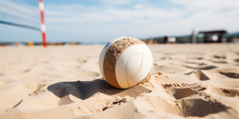 Close-up of a brown beach volleyball on the sand of a sunny shore. Summer beach entertainment, fun activity on vacation.