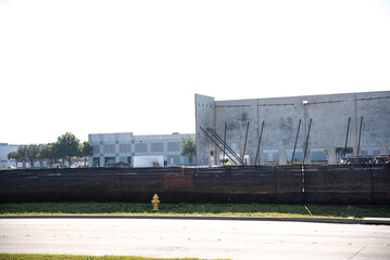 Precast concrete wall panels, prefabricated mega warehouse building material construction site with...