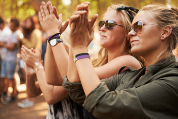 Hands, applause and woman friends at a music festival outdoor for a concert, party or event of celebration. Audience, crowd or young people at a carnival together for performance or entertainment - obrazy, fototapety, plakaty
