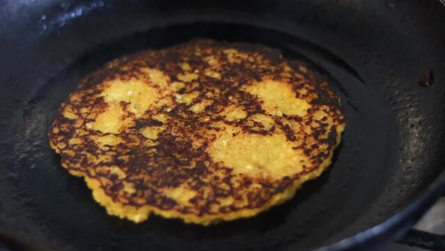 Artisanal preparation of corn cachapas, a typical Venezuelan dish.