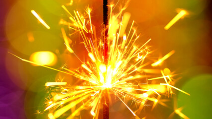 Bengal light burning on a bright background. Holiday party concept. New Year party sparkler