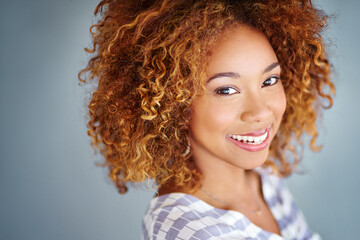 Fototapeta premium Portrait, smile or creative business woman isolated on a gray background mockup space. Confident face, happy professional designer or entrepreneur, young worker or employee at startup in South Africa