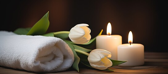 white tulip flowers with spa towel, beauty treatment concept background, romantic atmosphere with candle light, Generative Ai