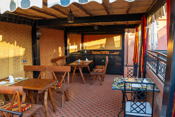 Upper terrace of a Riad.
Typical Moroccan house, with lots of decoration on the terrace. Sunny morning.