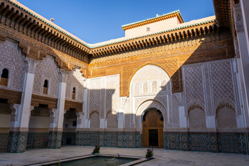 Interior of the main courtyard of the Ben Youssef Madrasa. Fountain in the middle of the patio....