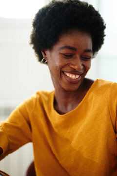 Smiling Afro Black Woman Looking Down