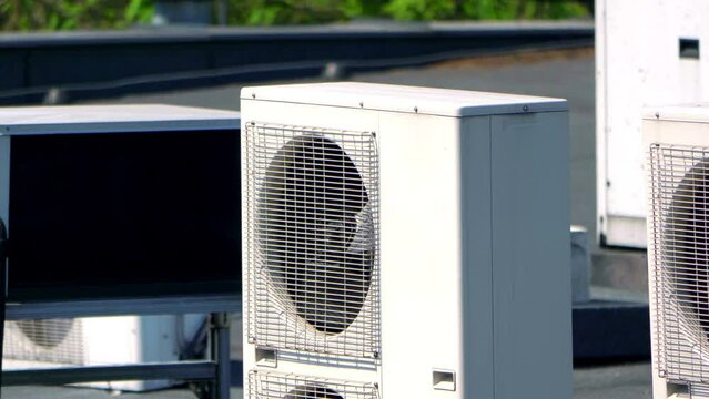 Modern Air Conditioning Units Installed on the Roof of a Commercial Building in 4k slow motion 60fps