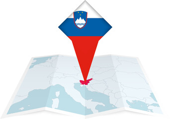 Slovenia pin flag and map on a folded map - obrazy, fototapety, plakaty