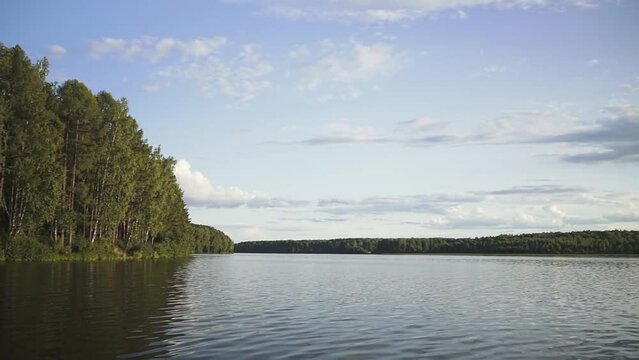 pond and catamaran. green Forest. lake in the forest. slow motion video. High-quality shooting in 4K