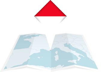 Monaco pin flag and map on a folded map