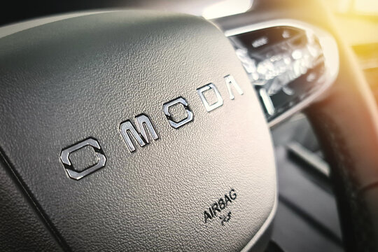 Close-up of the OMODA inscription on the steering wheel of the new Chinese Omoda c5 car. Almaty, Kazakhstan - September 18, 2023
