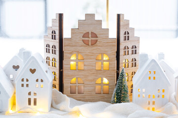 Cozy Christmas decor tiny house of small size on window sill with snow outside the window. Gift for...