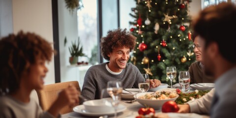 Fototapeta na wymiar Happy little girl and diverse family in a christmas dinner in a modern home 