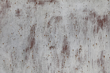 A close-up of a rusty metal door or wall. Rusty spots on iron.