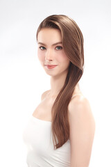 Fototapeta premium Beautiful young woman with clean fresh skin on white background, Face care, Facial treatment, Cosmetology, beauty and spa, women portrait.