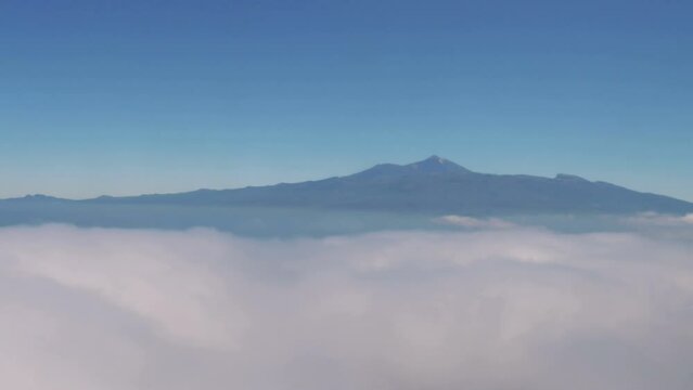 Scenic Airplane Flight Over the Tenerife Island's Clouds with a Stunning View of Mount Teide Volcano in 4k slow motion 60fps