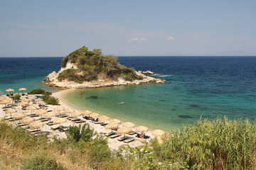 Fototapeta na wymiar Sunrise beach in the traditional Greek fishing village of Kokarri on the island of Samoss