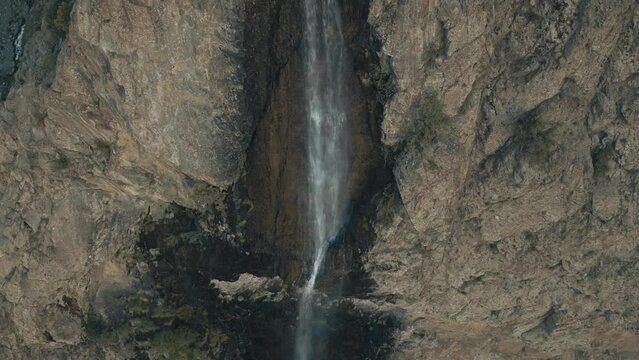 Aerial view reveals Water Fall in full as it goes up around Skardu in the Himalayas, Gilgit Baltistan, Pakistan.