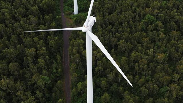 Aerial drone view of windmills in the tropical forest, La Plaine des Roches, Mauritius.