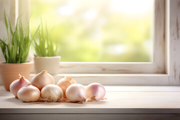 Shallots and onions on wooden counter with window and garden background. - obrazy, fototapety, plakaty