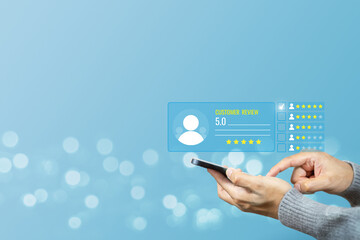 Hand hold mobile phone giving a five star rating with rating feedback scale. Concept of service...