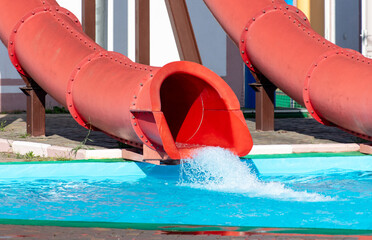 Red slide in the pool of the water park