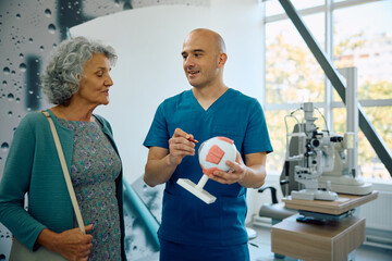 Senior woman talks to her ophthalmologist at clinic.