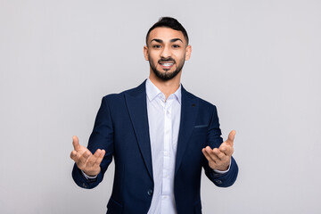 Happy turkish guy buisneesman in process speaks while shirt smart suit ellegant posing at camera.