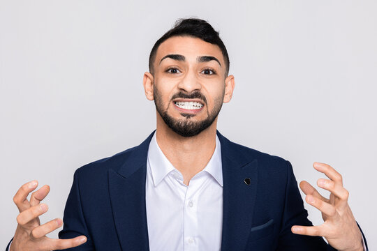 Happy cheerful young guy man speaking at camera representator young boy man in smart ellegant suit.