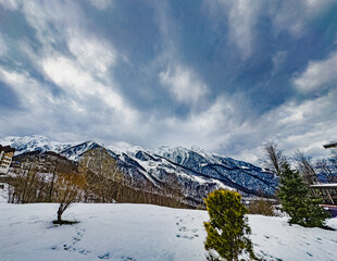 Fototapeta na wymiar Winter view of the mountains Krasnaya Polyana, Rosa Khutor, Olympic Village, Estosadok, Sochi