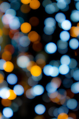 Obraz premium Abstract big circular bokeh background of Christmaslight,abstract background. Colorful blurry Christmas lights ornament at night.