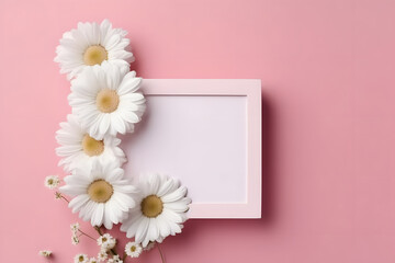 Blank greeting card in frame made of white chamomile flowers on pink background. Wedding invitation. Mock up