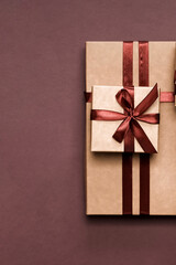 Christmas and zero waste, eco friendly packaging gifts in kraft paper on a wooden table, eco christmas holiday concept, eco decor banner	