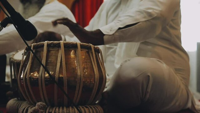 A set of drums being played at an Indian wedding.