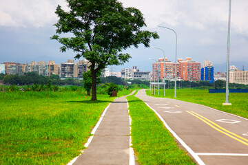 Blue sky and white clouds, river park, bicycle lane, bicycle, exercise