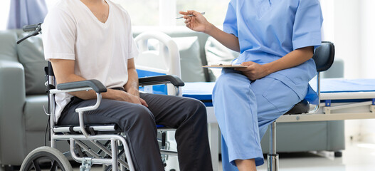 The doctor is giving advice to a man with erectile dysfunction. Patient with leg injury sitting in...