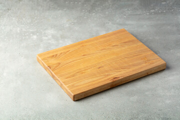 Cutting board on a stone table.