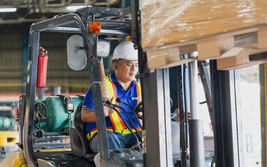 Worker driver at warehouse forklift loader works to containers box, worker man in warehouse with forklift