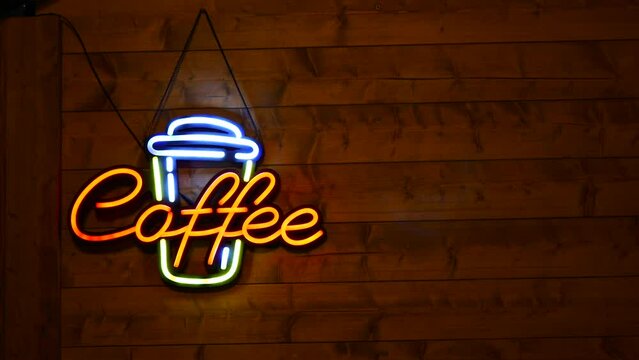 luminous led sign with letters . coffee