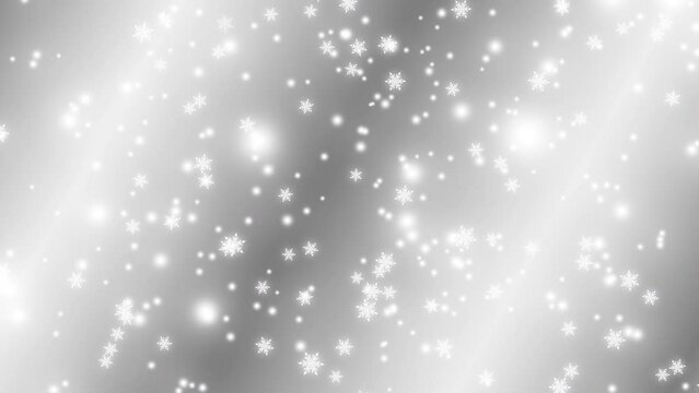 Abstract background with white snowflakes falling slowly from top to bottom on silver background. Merry Christmas, Happy New Year, and Happy Holidays greeting. Copy space.
