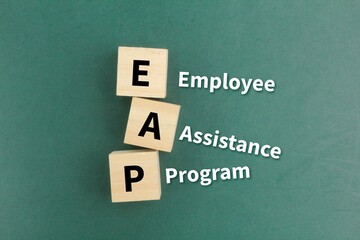 wooden square with the letters EAP or the word Employee Assistance Program