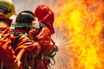 firefighter train fireman team extinguish spraying fire gas explosion. Fire fighter learning stop...