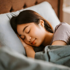 Asian woman sleeping peacefully in her bed