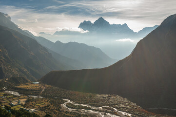 View of Kangtega (Kantaiga) and Thamserku mountains in Thame village during trekking in Nepal in a...
