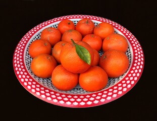 Fresh fruiter (Oranges) Captured in a Minimalist Composition on a Black Background