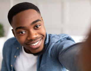 African boy smiling taking a selfie