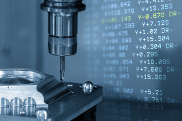 Abstract scene the CNC milling machine cutting  mold part and G-code data back ground.