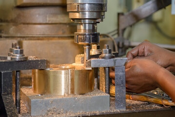 The boring process on NC milling machine with brass material.